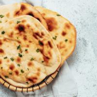 Naan · Fresh bread baked in clay oven.