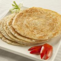 Plain Paratha · Flakey layers of baked dough filled with potatoes.