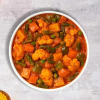 Veggie Korma Karma · Mixed vegetables cooked in delicate fresh spices, tomatoes and onions