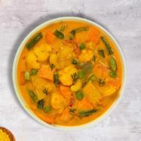 Somber Sambar · Lentils cooked with clarified butter, mixed vegetables and with our house special Sambar Spi...