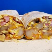 Breakfast Burrito. · Our burrito is wrapped around a combination of scrambled eggs, our spuds, cheddar cheese, an...