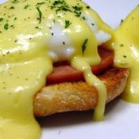 Eggs Benedict · A breakfast classic!! Two eggs and Canadian bacon are each served on top of English muffins ...
