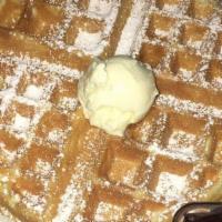 Belgian Waffle · A crunchy waffle is served with a side of syrup and butter. You may add additional toppings ...