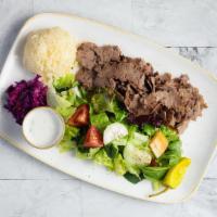 Lamb & Beef Gyros Plate · Slow cooked, thinly sliced, marinated lamb & beef. Served with rice, salad and pita bread. C...