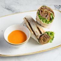 Lamb & Beef Gyros Wrap · Slow cooked, thinly sliced, marinated lamb & beef. Served on lavash bread with  greens and h...