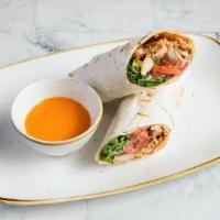 Chicken Gyros Wrap · Slow cooked, thinly sliced, marinated chicken breast & thigh. Served on lavash bread with gr...
