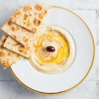 Classic Hummus with Pita · Chickpeas, tahini, lemon juice, garlic and spices with a side of pita bread. Vegan. Gluten-F...