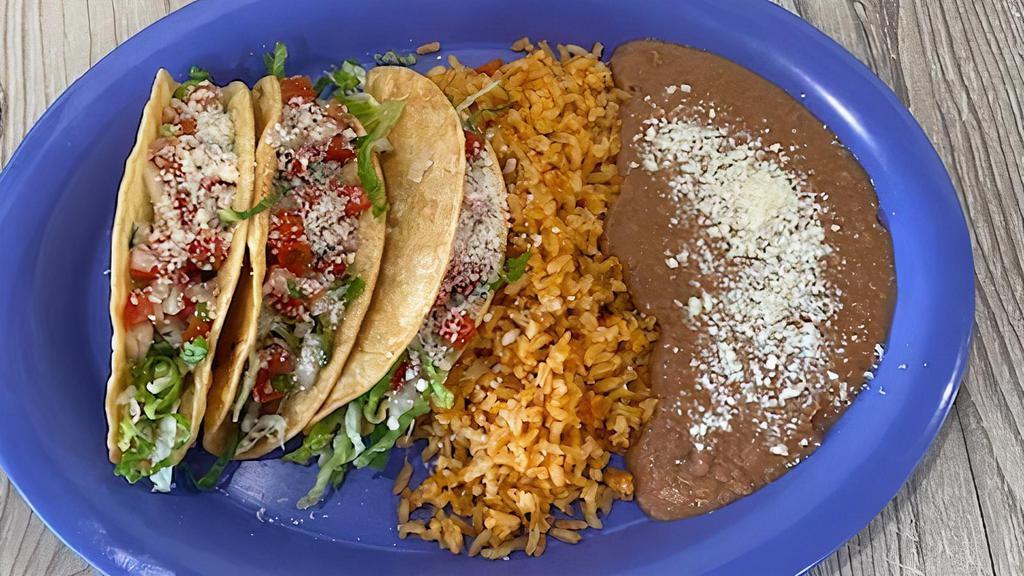 Crispy Tacos Plates · With three crispy tacos, the meat of your choice, chipotle mayo, lettuce, pico de gallo, cotija cheese, and guacamole with rice and beans.