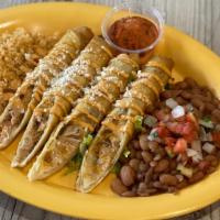 Flautas Plate · 4 Large pieces of Flautas (Fried Rolled up Tortilla stuffed with Chicken and Cheese), Sliced...