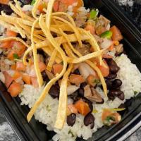 Mexican Burrito Bowl · Cilantro lime rice, Black beans, Pico de gallo, your choice of meat, and topped with tortill...