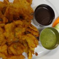 Vegetable Pakora · Vegan. Vegetables mixed with chickpea flour, Indian herbs and fried.