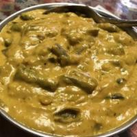 Coconut Beans · Vegan. Chef arjun's special. Green beans cooked with freshly grounded coconut in coconut sau...