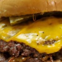 Double Smash Burger · Two (1/4) Quarter Pound Ground Beef Patties, Melted Cheese, Grilled Onions, Garlic Aioli, On...