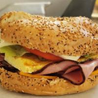 Breakfast Bagel · Egg, Monterey cheese, cheddar cheese and choice of meat. 
Tomato, letters.