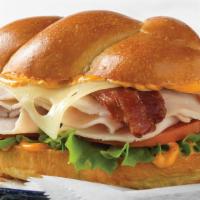 Turkey Bacon & Swiss Sandwich · Challah roll with turkey, bacon, swiss cheese, lettuce, tomato, and roasted tomato spread. C...
