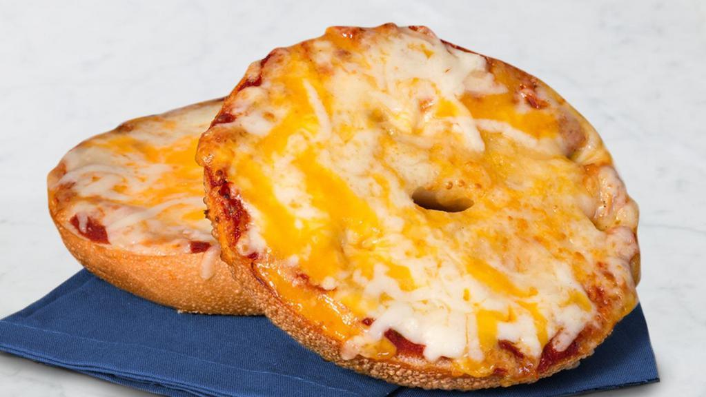Cheese Pizza Bagel · Choice of bagel with pizza sauce and topped with melted Asiago, parmesan, Romano, mozzarella, provolone, and cheddar cheese. Comes with a bag of sea salt kettle chips