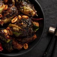 Kung Pao Brussels Sprouts · Wok-charred Brussels sprouts, peanuts, chili pods, Kung Pao sauce