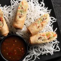 Vegetable Spring Rolls | 2 Count · Crispy rolls stuffed with julienned veggies, sweet chili dipping sauce