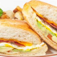 Breakfast Sandwich 2.0 · Butter-grilled ciabatta filled with a fried egg, bacon, jack and cheddar cheese, avocado and...