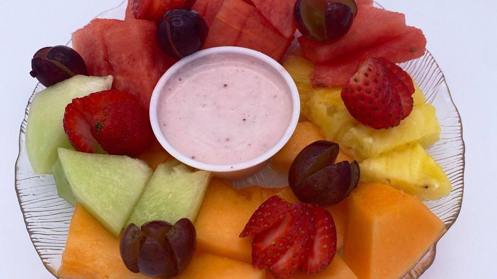 Seasonal Fresh Fruit Plate · Served with a side of strawberry-yogurt sauce.