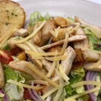 Chicken Caesar Salad · An entree salad with romaine lettuce, grilled chicken, crunchy croutons, red onion and fresh...