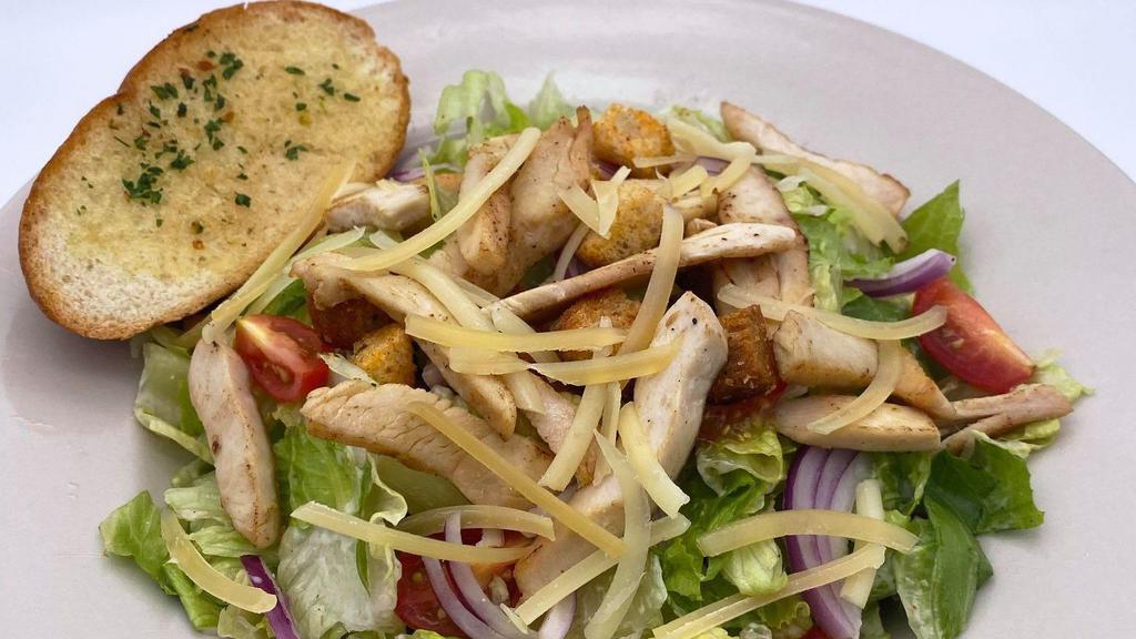 Chicken Caesar Salad · An entree salad with romaine lettuce, grilled chicken, crunchy croutons, red onion and fresh grated parmesan in a caesar dressing.