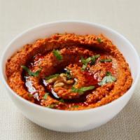Red Pepper Dip · Homemade roasted red pepper dip with garlic, tahini, pomegranate sauce and walnut. Served wi...