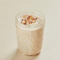 Almond Pudding · Homemade gluten-free pudding in a mason jar made with rice flour, milk, sugar, almond and co...