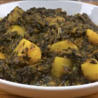 Vegan Aloo Saag (Seasonal Green Vegetable Potato Curry) · Seasonal greens and potatoes, onions, ginger, and garlic paste with aromatic curry spices.