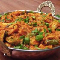 Vegan Mixed Vegetable Jalfrezi · Semi-dry dish with a blend of vegetables, Indian spices, onion, bell pepper, and cashew nuts.