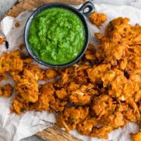 Vegan Himalayan Mixed Vegetable Pakora/Fritters · Crispy cabbages, carrots, onions, and capsicum cooked with sunflower oil.