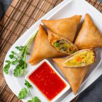 Samosas · Hand-made wheat flour wraps fried and filled with potatoes, onions, and spices served with o...