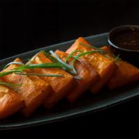 Yellow Tofu · House-made yellow bean tofu is a unique Burmese treat. Silky soft center with a slightly cri...