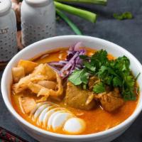 Ohn-No Khao Swe · Coconut chicken curry noodle soup.
A rich and creamy bisque with flour noodles and fried won...