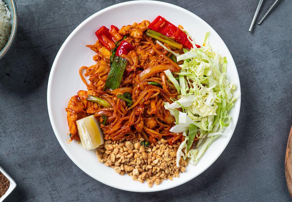Burmese Pad Thai Noodles · Rice noodles mixed with tofu, red bell pepper, onions, scallion, bean sprouts, egg, paprika, turmeric, peanuts, cabbage, and fish sauce.