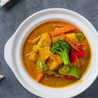 Pumpkin Tofu Curry · A delicious stew made with tofu, locally grown pumpkin, onions, garlic, ginger and turmeric....