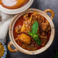 Burmese Style Chicken Curry · Chicken thighs simmered in lemongrass, onions, ginger, garlic, masala, paprika, potato, turm...