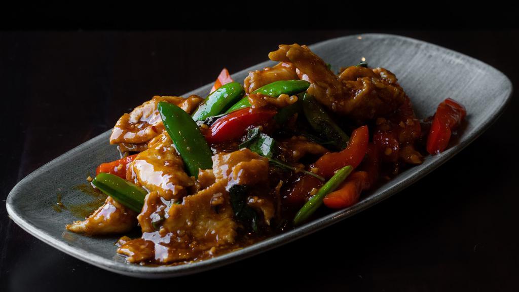 Lemongrass Chicken · Sambal chili, dried chilis, garlic, soy sauce, fish sauce, snap peas, red bell peppers, lemongrass and fresh basil. Gluten-free option available.