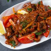 Beef Kebat · Marinated tri tip stir-fried with onions, tomatoes, mint, cilantro jalapeños, turmeric, tama...