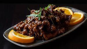 Sesame Chicken · Hand-cut strips of chicken, lightly fried in soy sauce, honey, topped with sesame seeds and ...