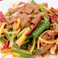 Mongolian Beef · 蒙古牛肉  *SPICY  Beef sauteed with scallions, onions, and roasted hot peppers in spicy sauce.