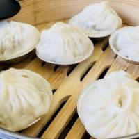 Steamed Shanghai Dumplings (6) · Classic XLB (xiao long bao) soup dumpling filled with pork, ginger, and onion.
