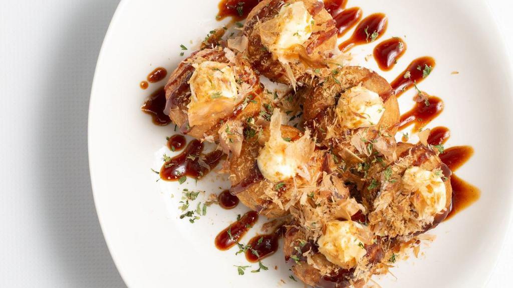 Takoyaki · 6 pieces of octopus balls topped with sauce, nori, and bonito.