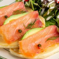 Salmon and Avocado Pancakes · Wild smoked salmon and avocado served on pancakes with a side salad.