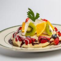 Mixed Fruit and Chocolate Pancakes · Served with an abundant assortment of fruits topped with a sweet crème anglaise