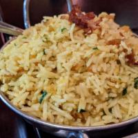 Coconut Rice · Finest basmati with mustard, curry leaves, lentils and coconut.
