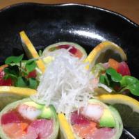 Naruto Roll · Cucumber wrapped with tuna, salmon, yellowtail, gobo, kanpyo, avocado, crab, and sunomono sa...