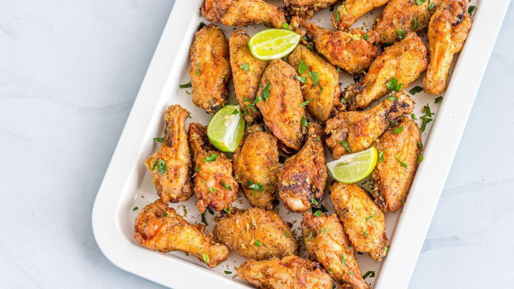 The Lemon Pepper Wings · Exotic lemon flavored wings topped with peppers and cooked to perfection.