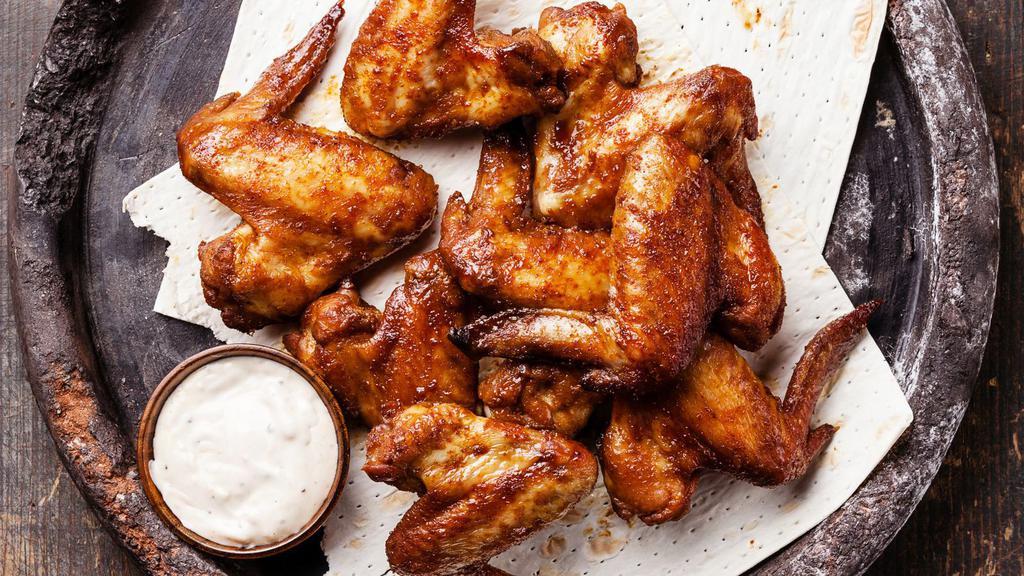 Bbq Chicken Wings · Sweet tangy barbeque flavoured chicken wings. Served with ranch sauce.