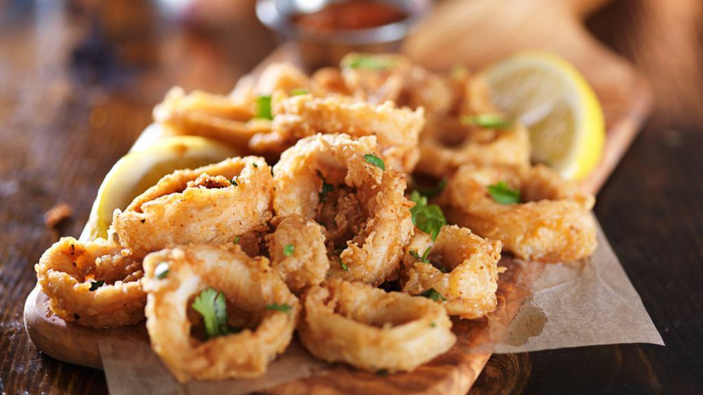 Fried Calamari · Fried squid slowly cooked.